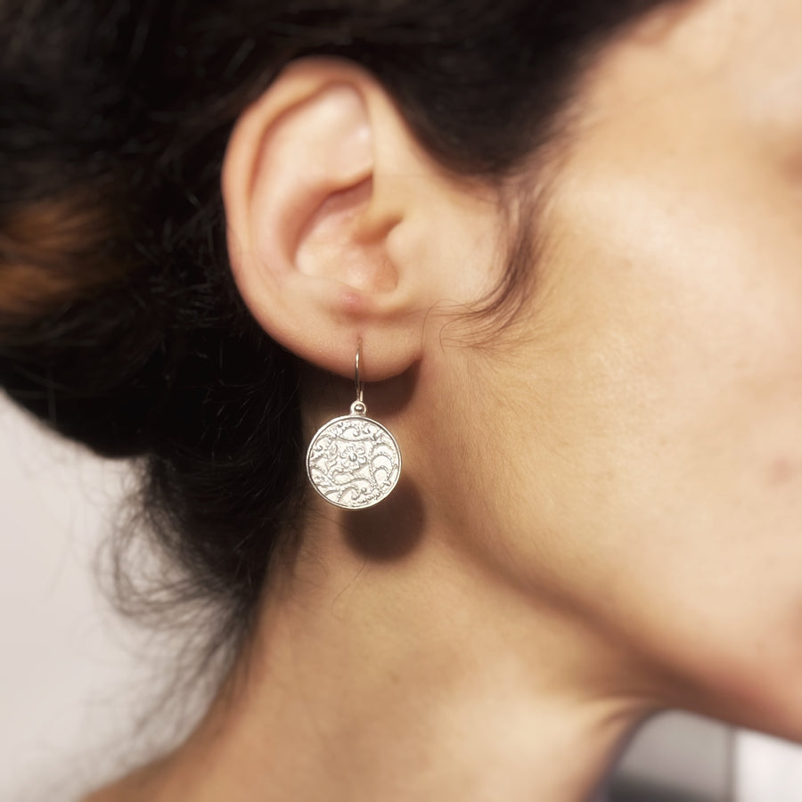 Ornamental dangle earrings