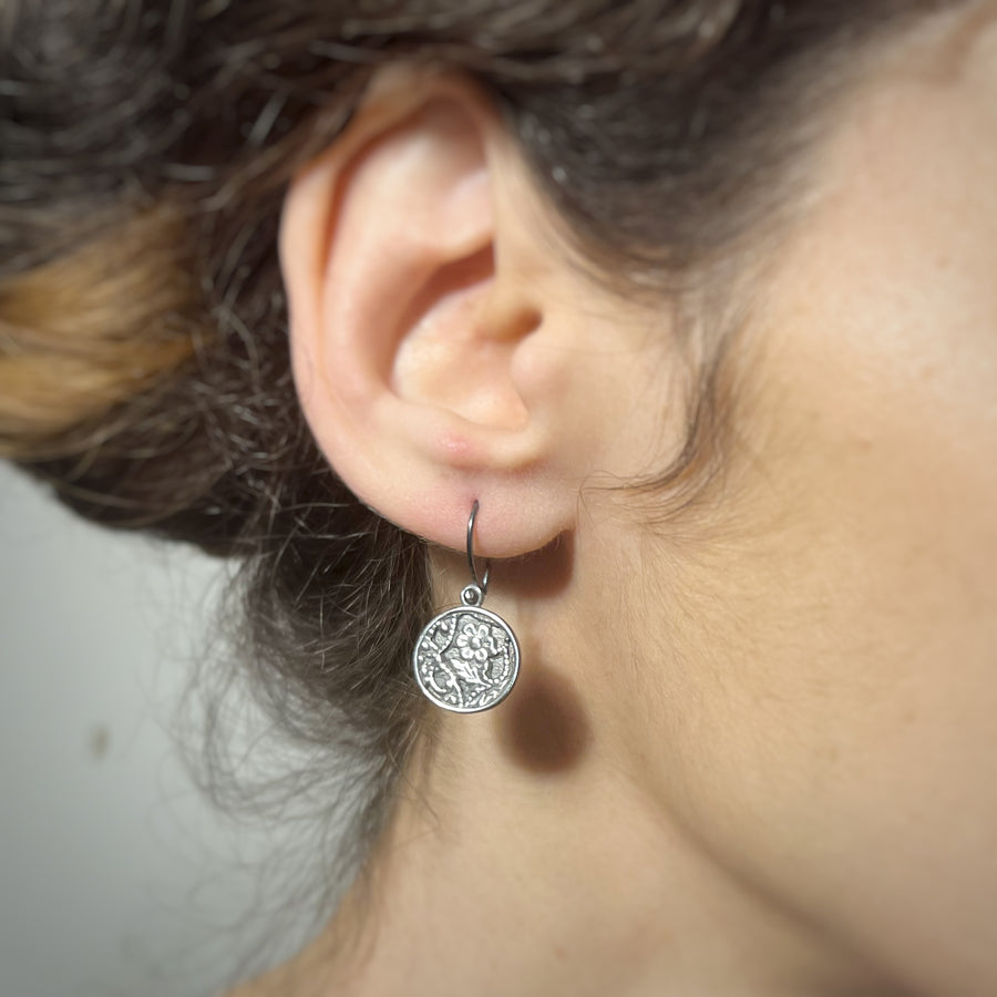 Ornamental dangle earrings