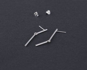 Stick mismatched earrings