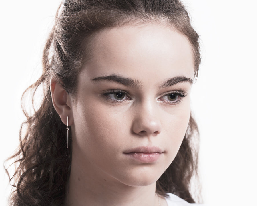 Stick mismatched earrings